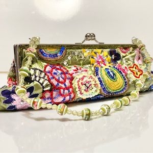 Adorable beaded satin clutch purse in sea foam green with beaded handle.